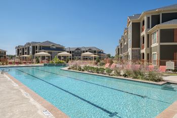 Expansive resort style pool and custom fountain, lounge deck, and cabanas